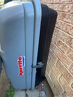 Gray Karrite Voyager cargo carrier side view with logo and lock hasp