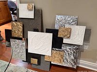 Front view of entire mixed media relief showing layered panels and overall composition
