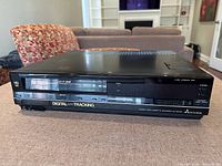 Front view of Mitsubishi HS-422UR VCR showing cassette slot, controls and branding