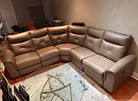 Front view of entire L-shaped leather sectional sofa