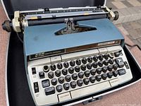 Top view of Smith-Corona Electra 220 in case, keyboard and carriage visible