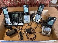 overview of digital answering base, four handsets, charging cradles and cables