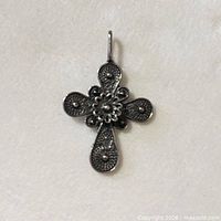front view of sterling silver filigree cross pendant with bail