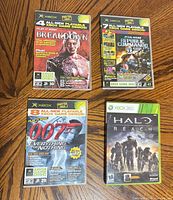Group shot of four game/demo cases: Halo Reach, Breakdown demo, Republic Commando demo, 007 demo