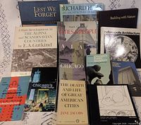 All thirteen books spread out showing front covers