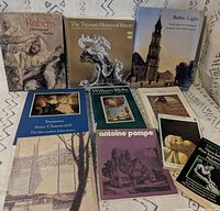 Full group shot of all ten art books laid out