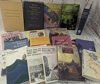 Group view showing all 18 books standing and lying flat