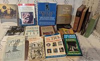 Front view of all 17 books laid out upright and flat