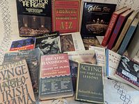 Spread of 15+ theatre books showing covers including Scenery for the Theatre, Theatre Handbook, Acting: The First Six Lessons