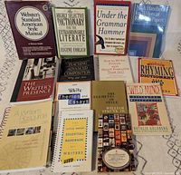 All fourteen books laid out showing front covers