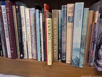 Shelf section showing atlases, exploration, state pictorials and cultural titles