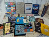 All 24 books laid out front covers visible