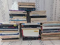 Wide shot showing four tall stacks of paperback plays