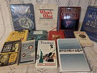 All 13 books laid out, front covers visible