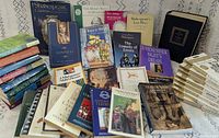 All books spread out, showing hardcover complete works and numerous paperback plays