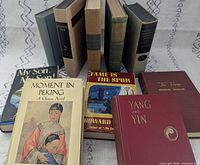All ten books standing and lying to show covers and spines