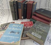Group shot of fifteen vintage books, three with dust jackets visible