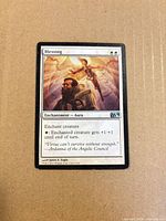 Front of Blessing card shows illustration, mana cost, text box, visible edge wear