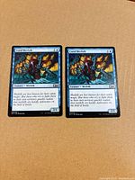 Both Coral Merfolk cards side by side showing fronts and condition