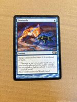 Front of Diminish card showing artwork, mana cost, text box and set symbol