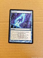 Front of the Downsize card showing artwork, title, type line, text box and set information