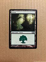 Front of Forest card showing artwork, set code M14 and collector info