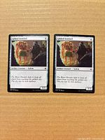 Front view of both Gilded Sentinel cards together