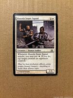 Front of Haazda Snare Squad card showing artwork, mana cost, text box, power/toughness