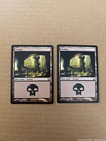 Both Swamp cards front view