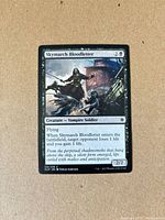 Front of Skymarch Bloodletter card showing artwork, text, set symbol