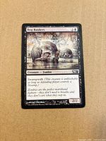 Front of Bog Raiders card showing artwork, mana cost, text box and set symbol