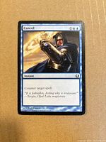 Front of Cancel card showing artwork, mana cost, text box, set code M12