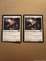 Both Dawnstrike Paladin cards front view