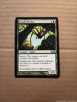 Front of Deadly Recluse card showing artwork, text, set symbol