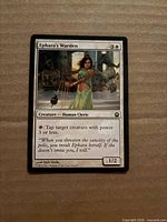 Front view of Ephara's Warden card showing artwork, text, mana cost, and condition