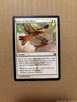 Front of Eyes in the Skies card showing artwork, card text, set info