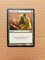 Front of Giant Growth card displaying artwork, set symbol, text and condition