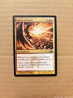 Front view of Gleam of Battle card showing artwork, mana cost, type line and text