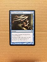 Front of Grasp of Phantoms card showing artwork, mana cost, text box