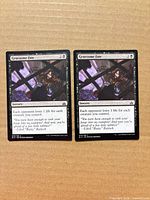 Two Gruesome Fate cards side by side front view