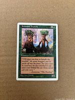 Front of Ironroot Treefolk card showing artwork, casting cost 4G, power/toughness 3/5, visible edge wear