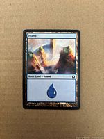 Front of Island card showing artwork, title bar, type line and blue mana symbol