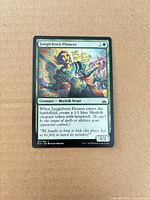 Front of Jungleborn Pioneer card showing artwork, mana cost, text and condition
