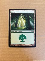 Front of Magic 2011 Forest basic land card