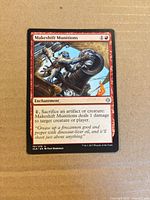 Front of Makeshift Munitions card displaying artwork, mana cost, text box, set number 151/279