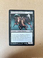 Front of Minotaur Abomination card showing artwork, mana cost, type line, set symbol