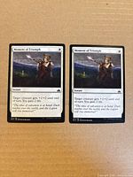 Both Moment of Triumph cards side by side