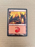Front of Mountain card showing artwork, set number, and red mana symbol