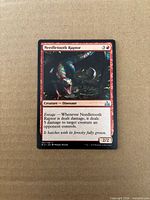 Front of Needletooth Raptor card showing artwork, text, set symbol, and condition