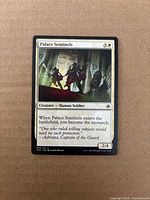 Front of Palace Sentinels card showing artwork, mana cost, text, set code CN2, artist credit, 2/4